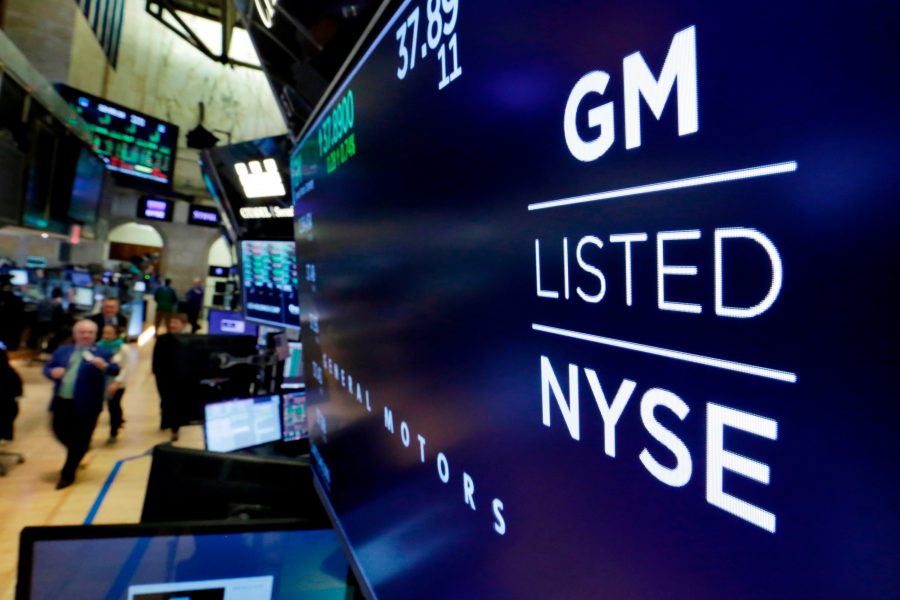 FILE - In this April 23, 2018, file photo, the logo for General Motors appears above a trading post on the floor of the New York Stock Exchange. General Motors reports earnings on Tuesday, Oct. 24, 2023.