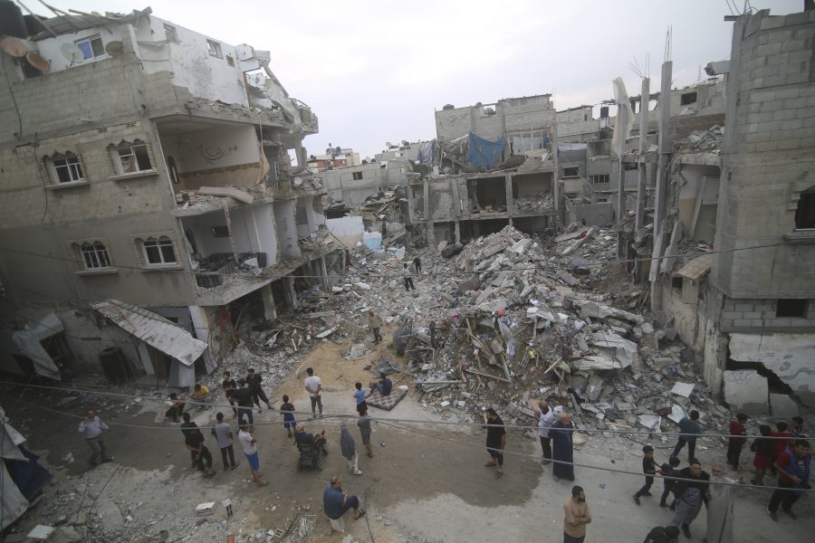 Palestinians inspect the rubble Abu Helal family in Rafah refugee camp, Gaza Strip, Monday, Oct. 9, 2023. The strike killed dozens of people.