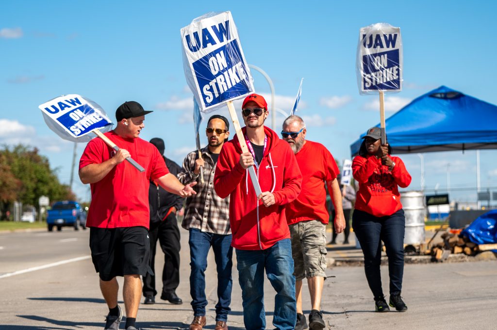 UAW members strike outside the Ford Assembly Plant in Wayne on Friday, Oct. 6, 2023.