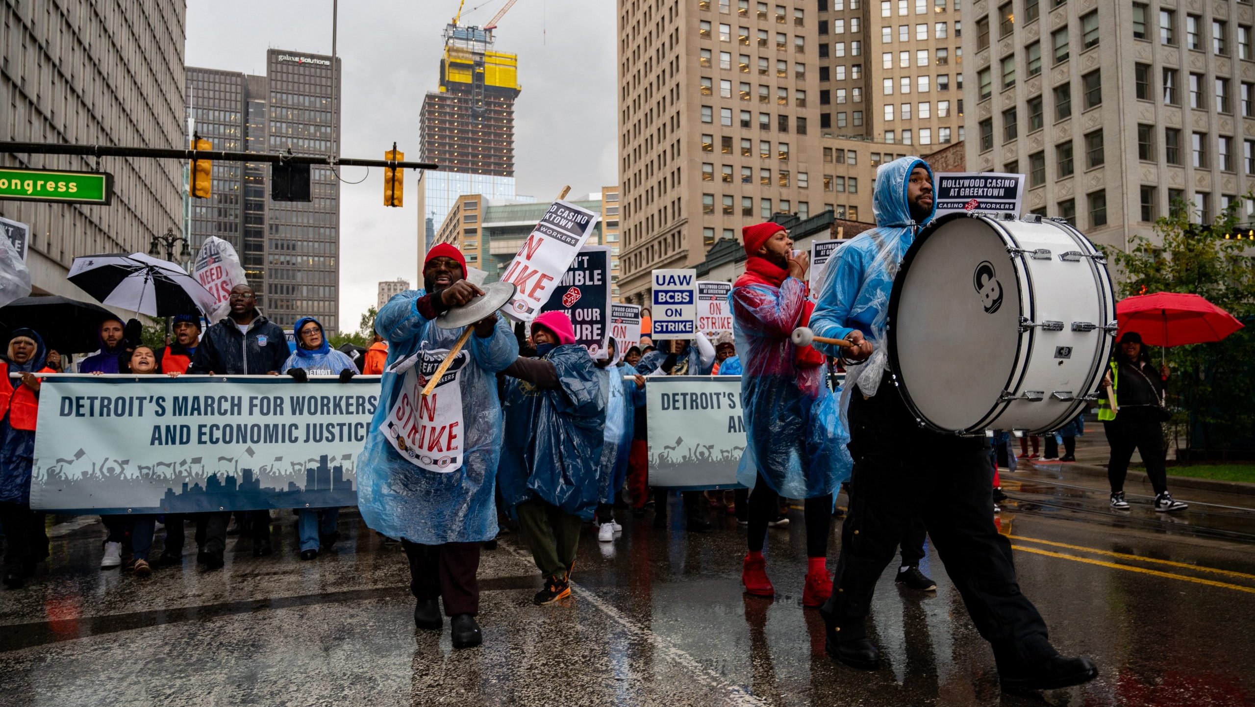 Striking union members and supporters march in Detroit to rally for a new contract on Oct. 19, 2023.