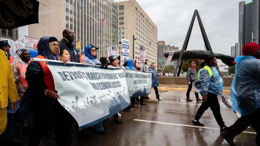 Striking union members and supporters march in Detroit to rally for a new contract on Oct. 19, 2023.