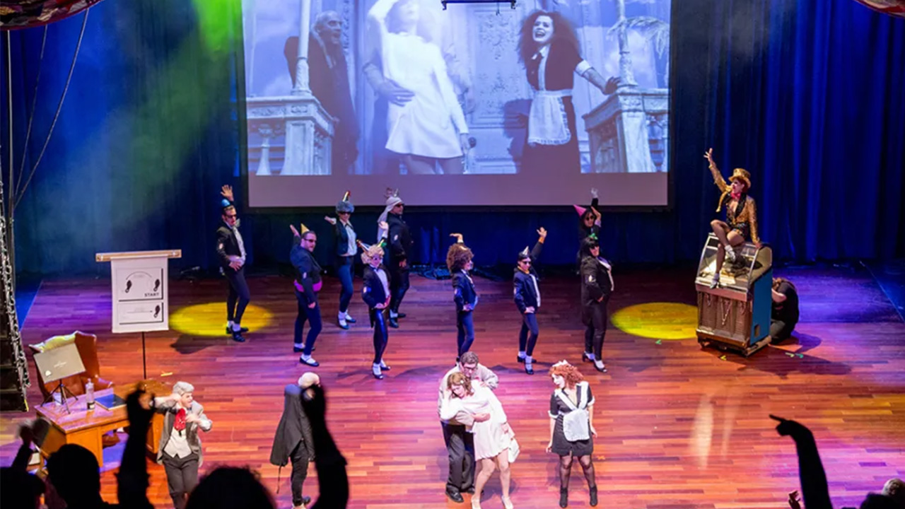 The Rocky Horror Picture Show shadow cast performs alongside the film.