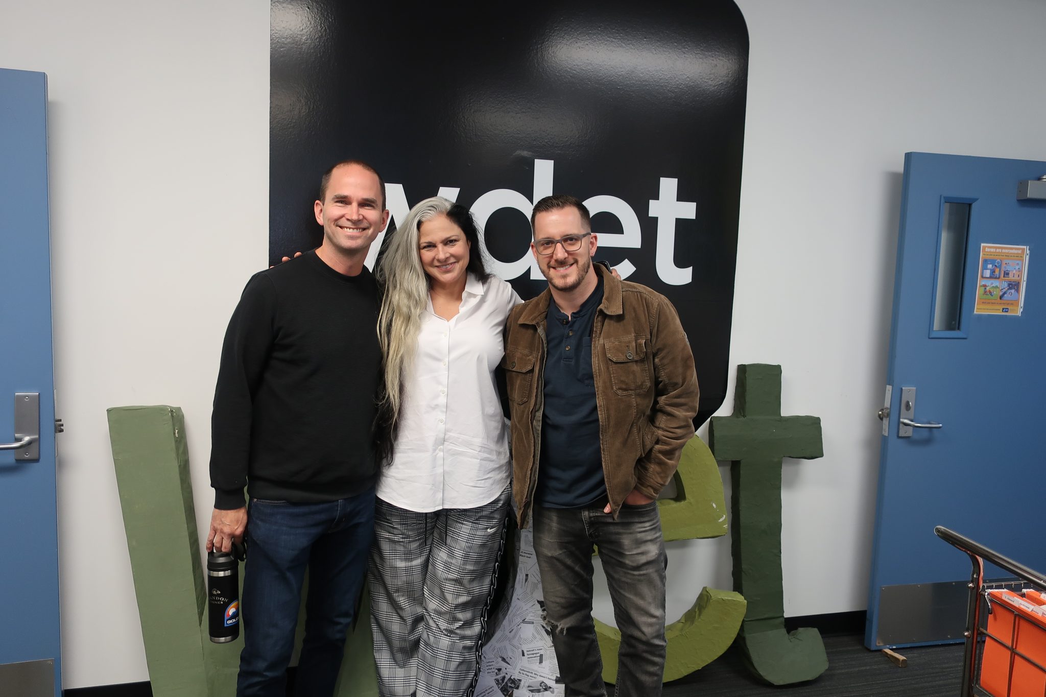 Oak & Reel's Michelin-starred chef and owner, Jared Gadbaw (left), poses with Ann Delisi and Chef James Rigato at WDET studios.