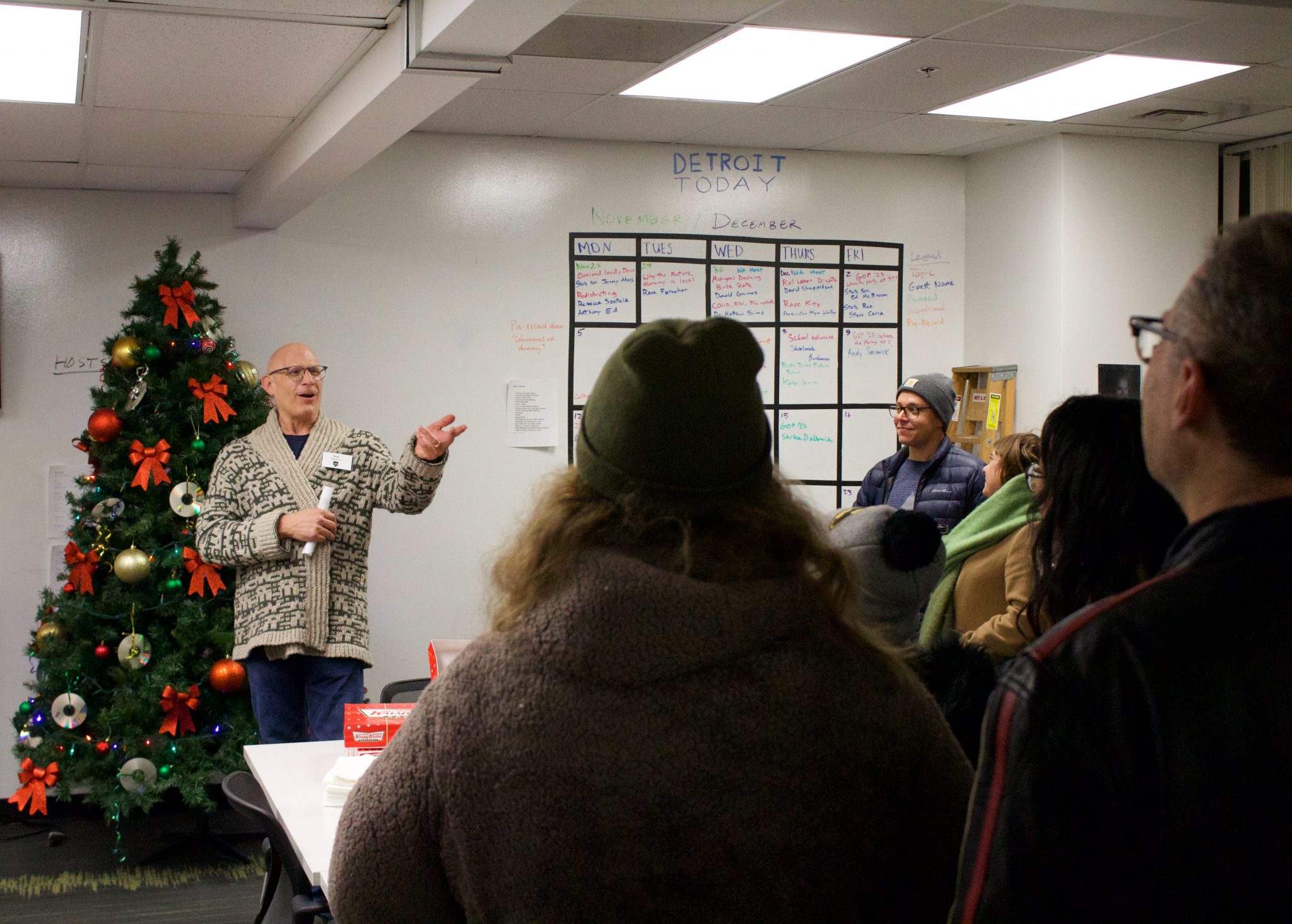 Rob Reinhart leads a group of listeners on a tour of WDET during Noel Night 2022.