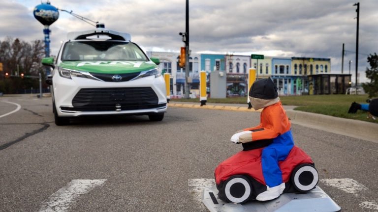 May Mobility’s automated shuttle, performing a driving intelligence test at a simulated pedestrian crossing.