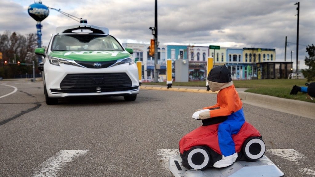 May Mobility’s automated shuttle, performing a driving intelligence test at a simulated pedestrian crossing.