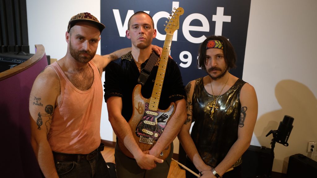 Sun Astros pose for a photo inside WDET's Studio A.