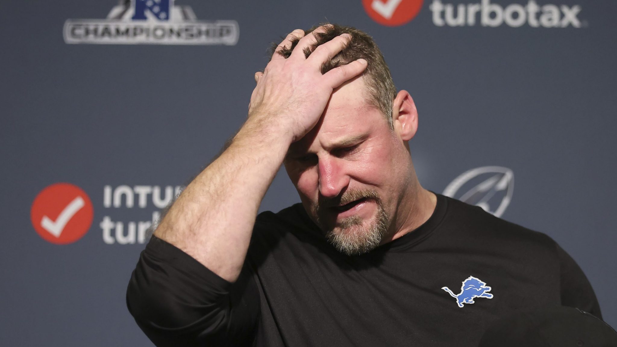 Detroit Lions head coach Dan Campbell reacts while speaking at a news conference after the NFC Championship NFL football game against the San Francisco 49ers in Santa Clara, Calif., Sunday, Jan. 28, 2024.