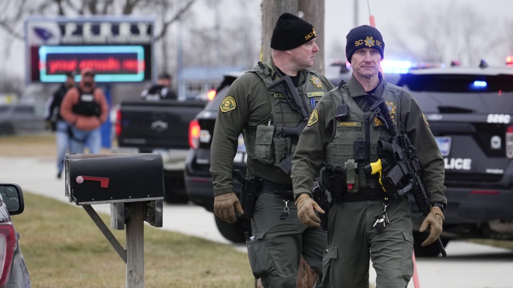 Police respond to Perry High School in Perry, Iowa., Thursday, Jan. 4, 2024. Police say there has been a shooting at the city's high school.(AP Photo/Andrew Harnik)