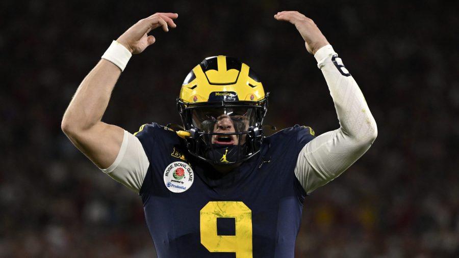 Michigan quarterback J.J. McCarthy (9) reacts after running back Blake Corum scored a touchdown during overtime at the Rose Bowl CFP NCAA semifinal college football game against Alabama Monday, Jan. 1, 2024, in Pasadena, Calif.