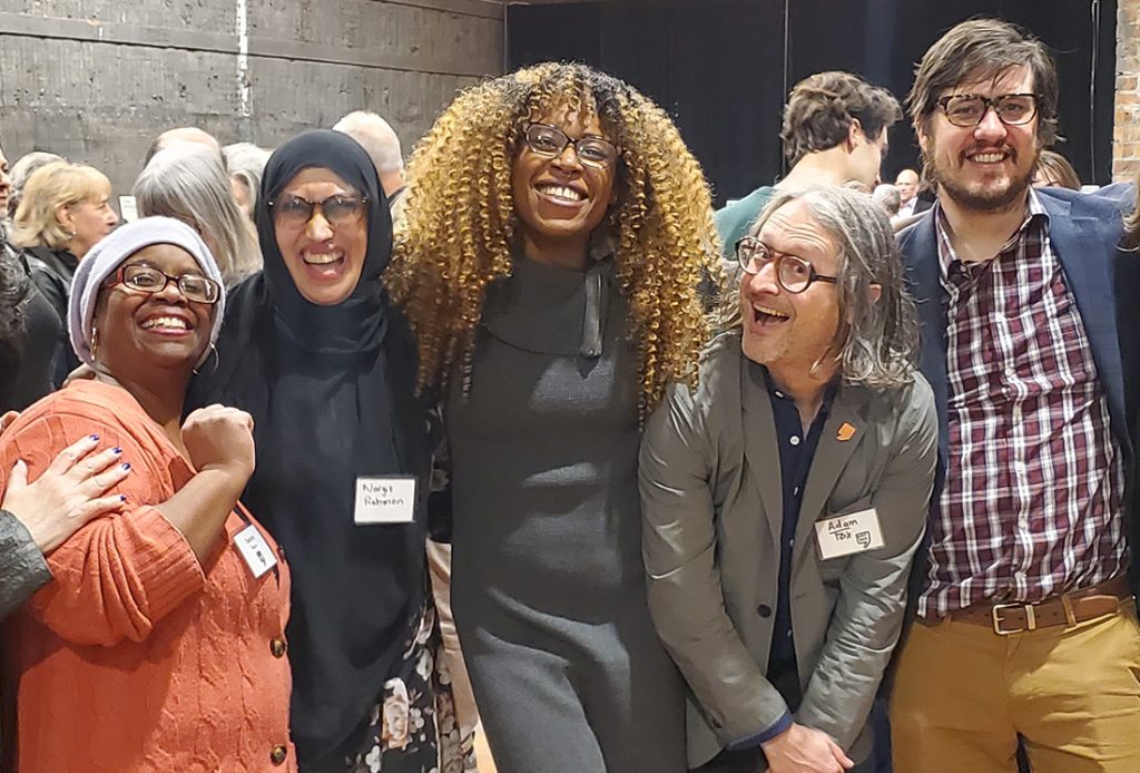 WDET staff pose for a photo at the station's 75th anniversary party at Jam Handy in Detroit.