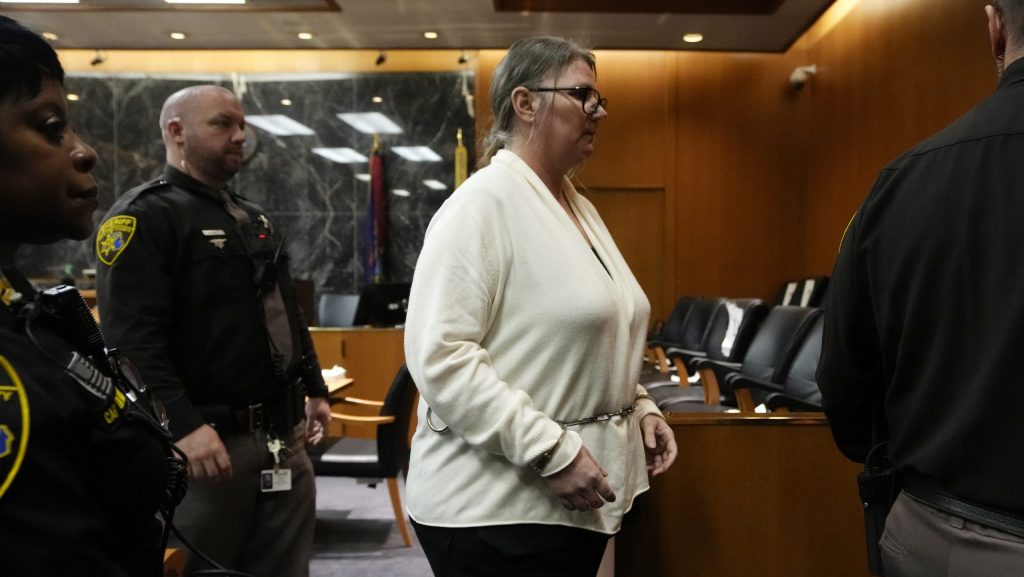 Jennifer Crumbley is escorted out of court, Monday, Feb. 5, 2024 in Pontiac, Mich.