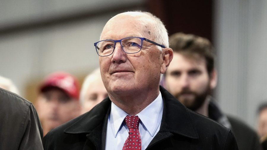 FILE - Michigan Republican Party chair Pete Hoekstra listens at a campaign rally in Waterford Township, Mich., Feb. 17, 2024.