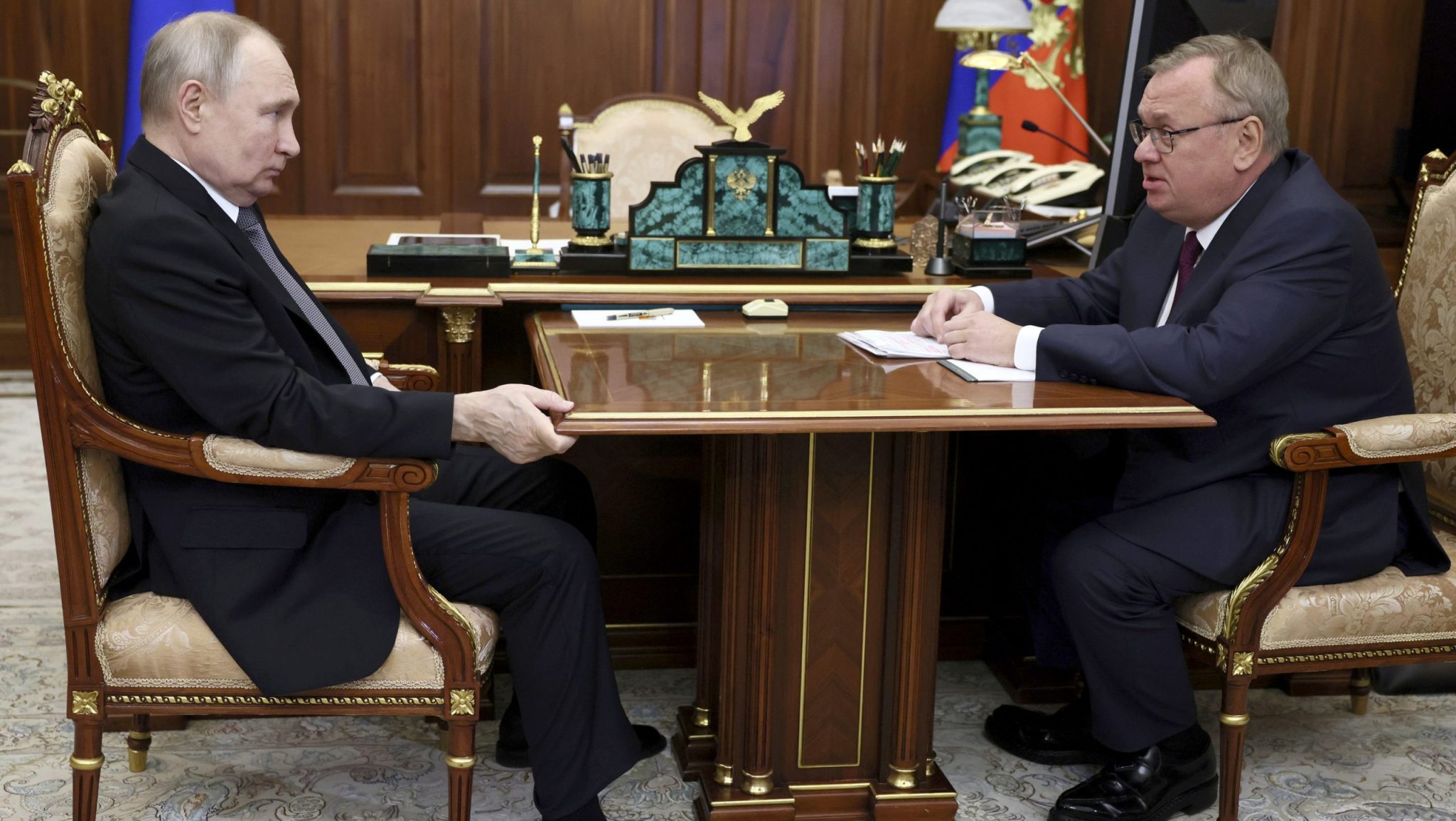 Russian President Vladimir Putin, left, listens to VTB Bank Chairman Andrei Kostin during their meeting in Moscow, Russia, July 11, 2023.