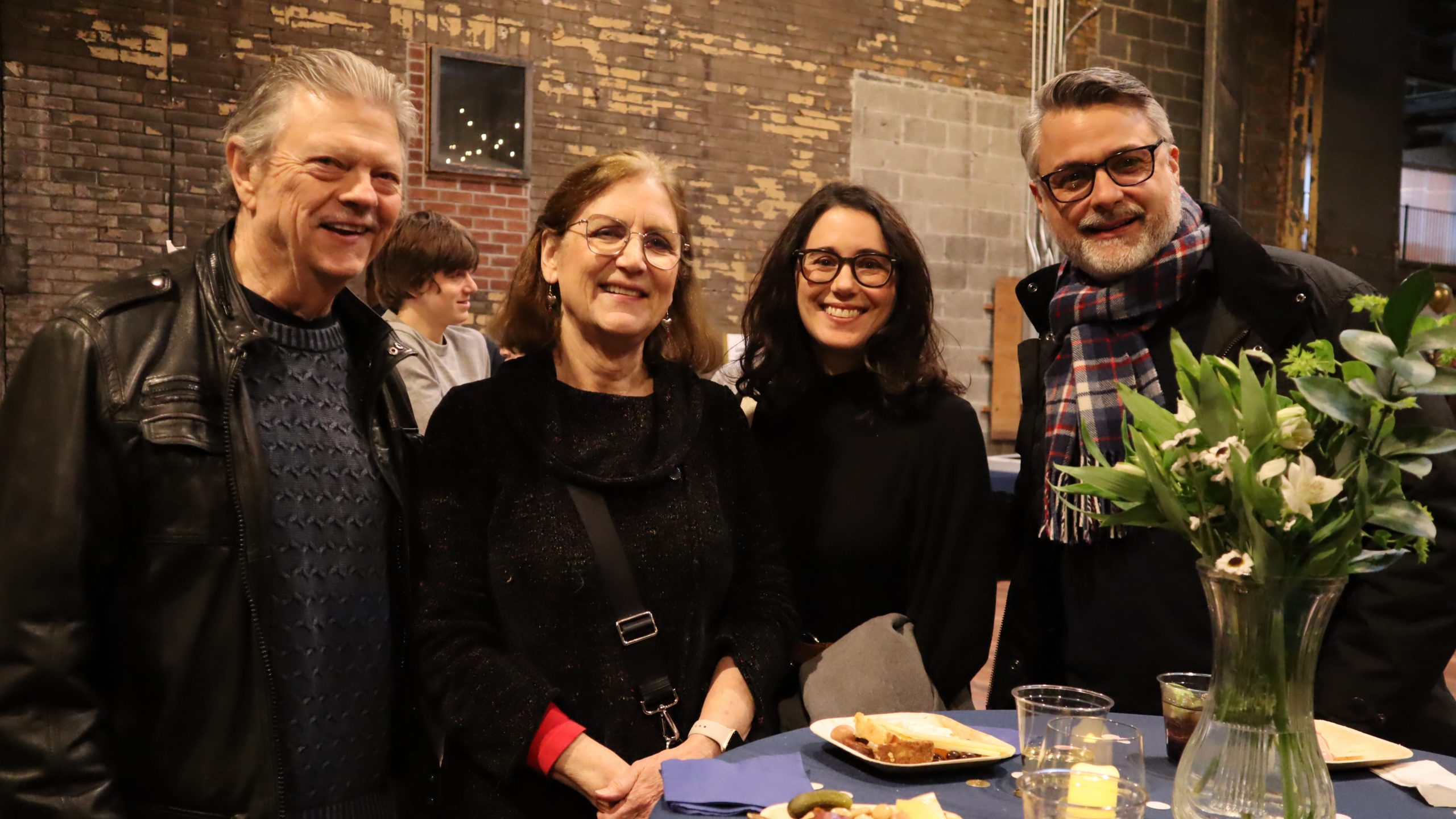 Guests pose for a photo at WDET's 75th anniversary party on Feb. 13, 2024, at the Jam Handy in Detroit.