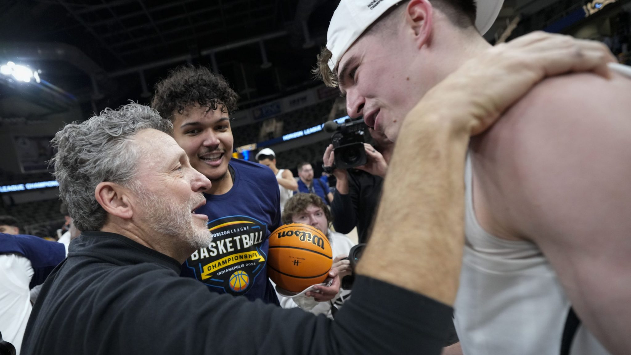 Oakland University coach Greg Kampe, left, talks with guard Blake Lampman after the team's win over Milwaukee in an NCAA college basketball game for the championship of the Horizon League men's tournament in Indianapolis, Tuesday, March 12, 2024.