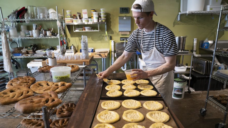 Maxwell Leonard applies an egg wash to a pastry at his shop There is No Secret Bakery located at 821 Livernois Street in Ferndale on Wednesday, Feb. 7, 2024.