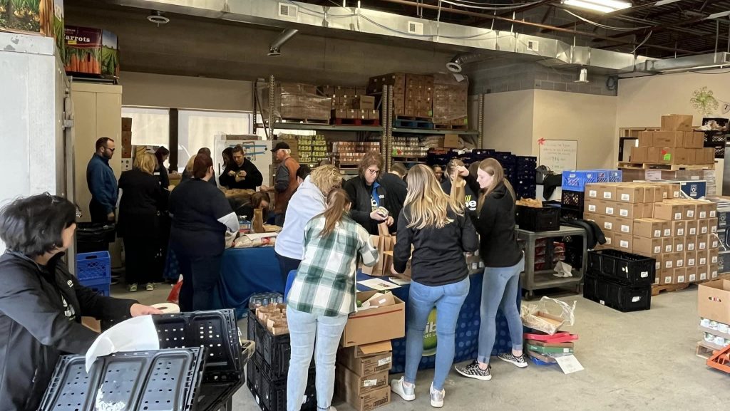 Volunteers packing up food at Metro Food Rescue.