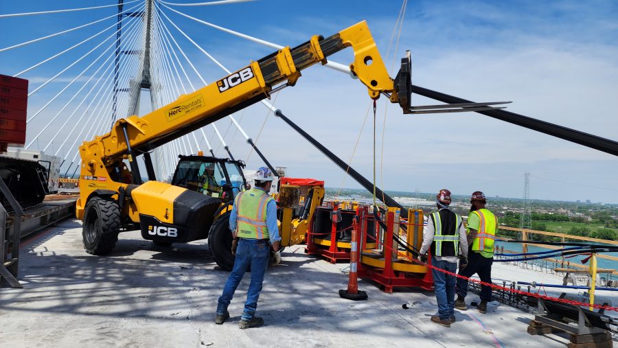 A construction crew works on the deck of the Gordie Howe International Bridge, May 14, 2024.