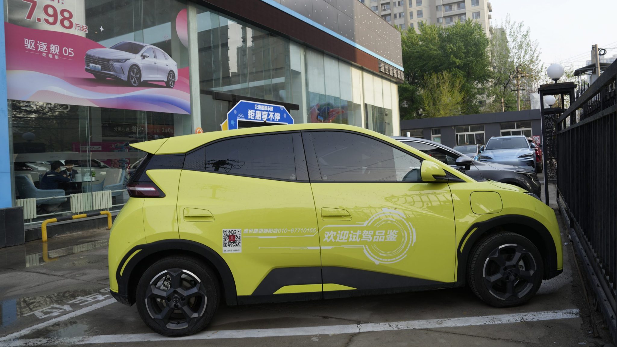 A Seagull electric vehicle from Chinese automaker BYD for test driving is parked outside a showroom in Beijing, Wednesday, April 10, 2024.