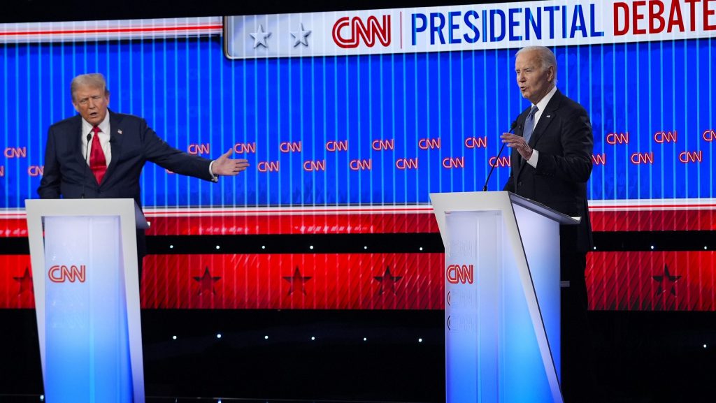 Republican presidential candidate former President Donald Trump, left, and President Joe Biden, right, speak simultaneously during a presidential debate hosted by CNN, Thursday, June 27, 2024, in Atlanta.