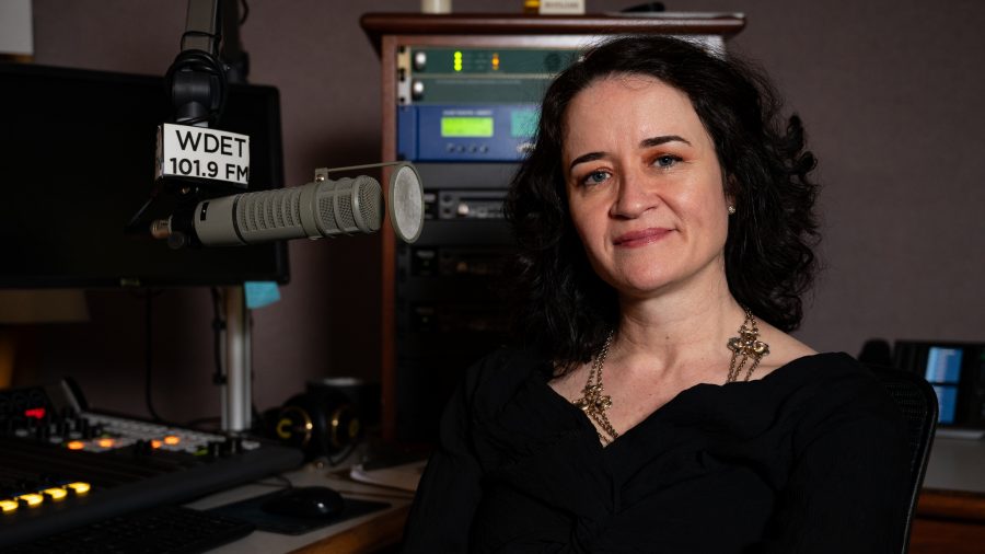 "Alternate Take" host Liz Warner poses for a photo inside the WDET studios.