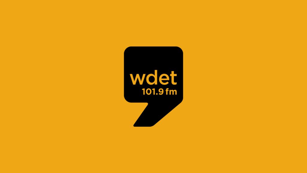 WDET black logo on orange background