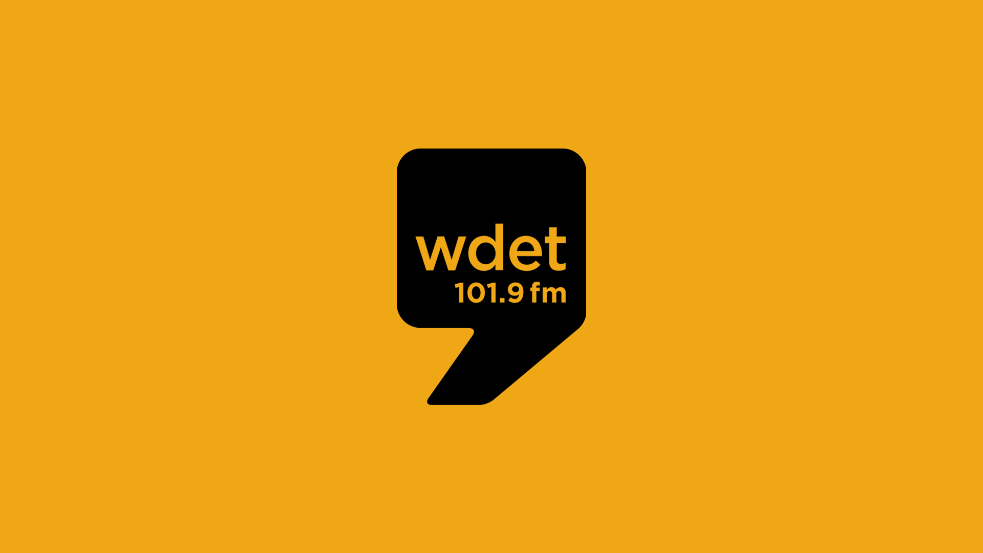 WDET black logo on orange background