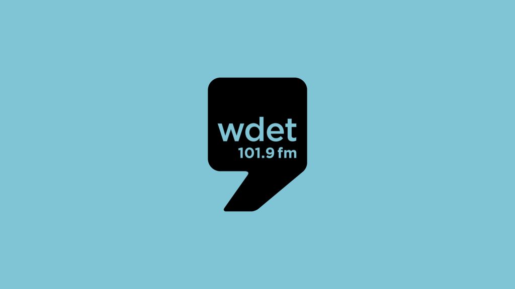 WDET black logo on blue background