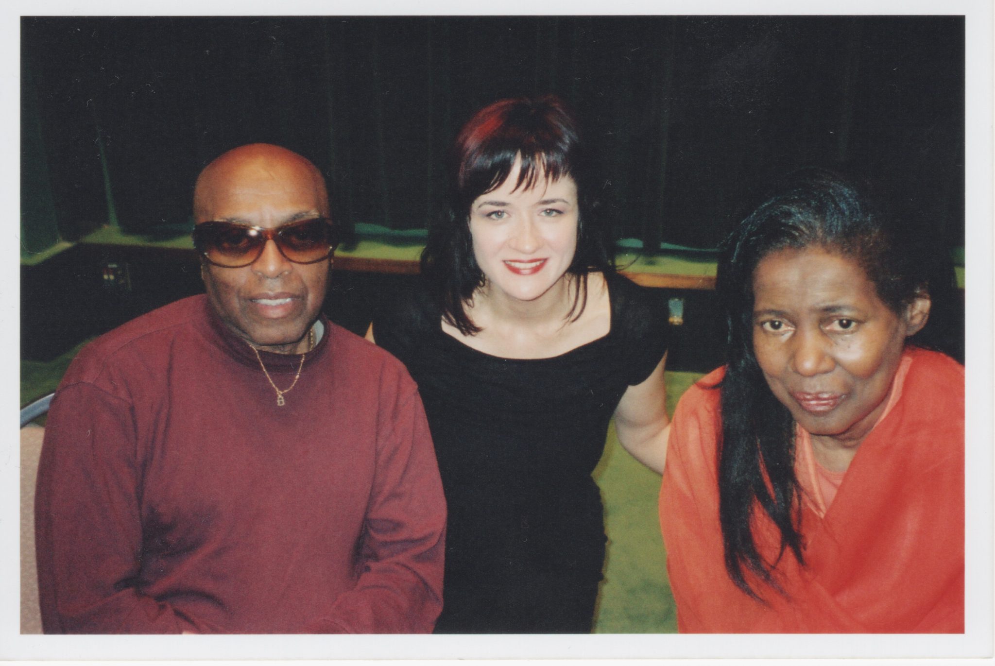 Roy Haynes, Liz Warner and Alice Coltrane smile together at an event