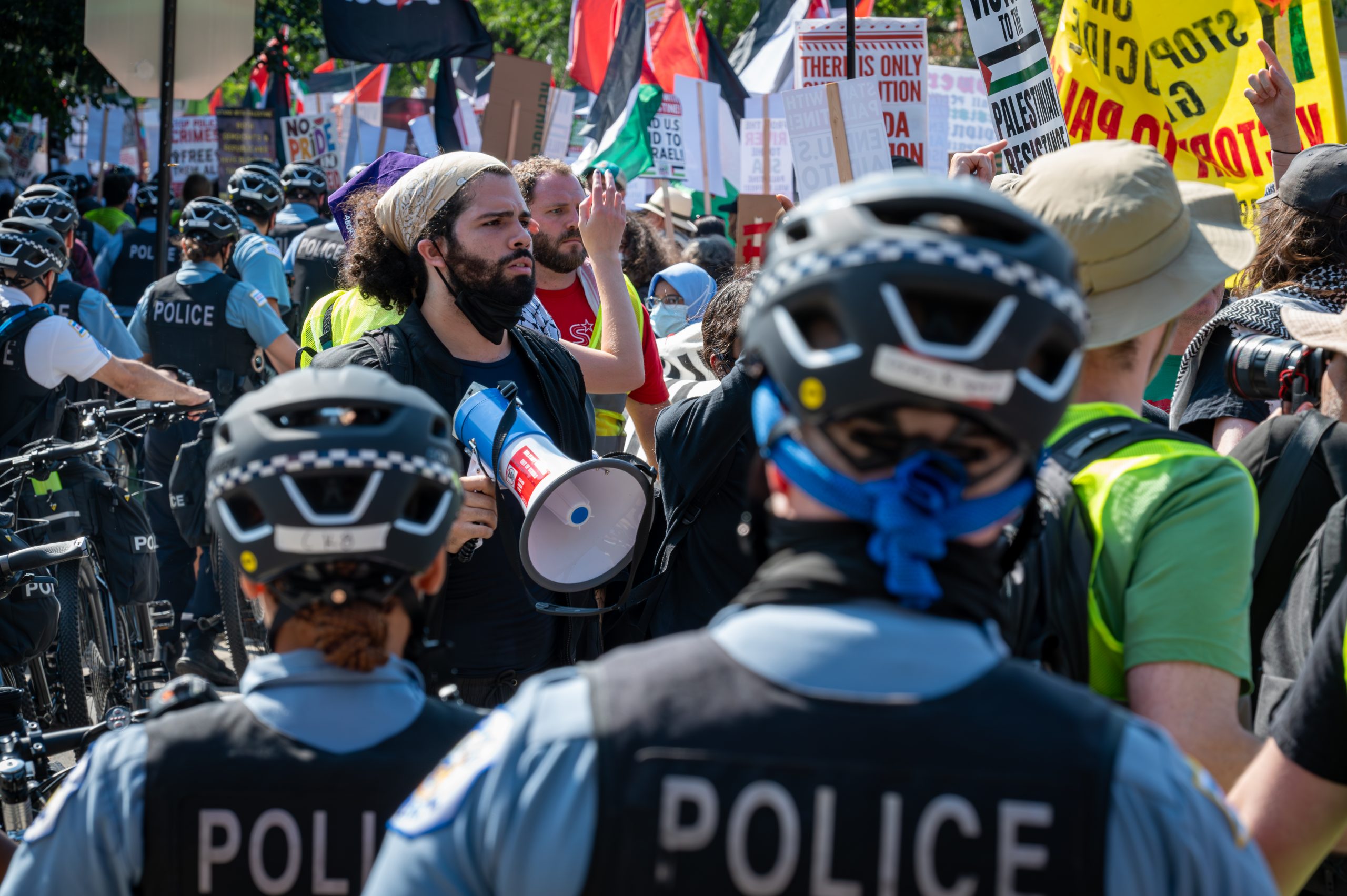 Pro-Palestinian and anti-war demonstrators march outside the Democratic National Convention in Chicago on Monday, Aug. 19, 2024.