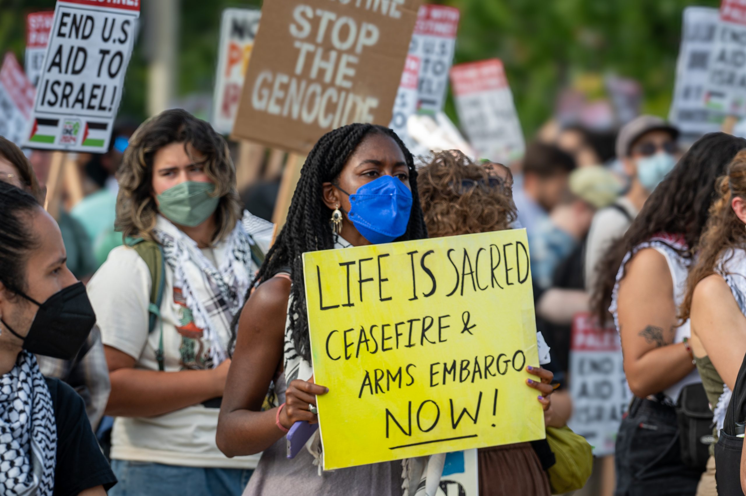 Pro-Palestinian and anti-war demonstrators march outside the Democratic National Convention in Chicago on Monday, Aug. 19, 2024.