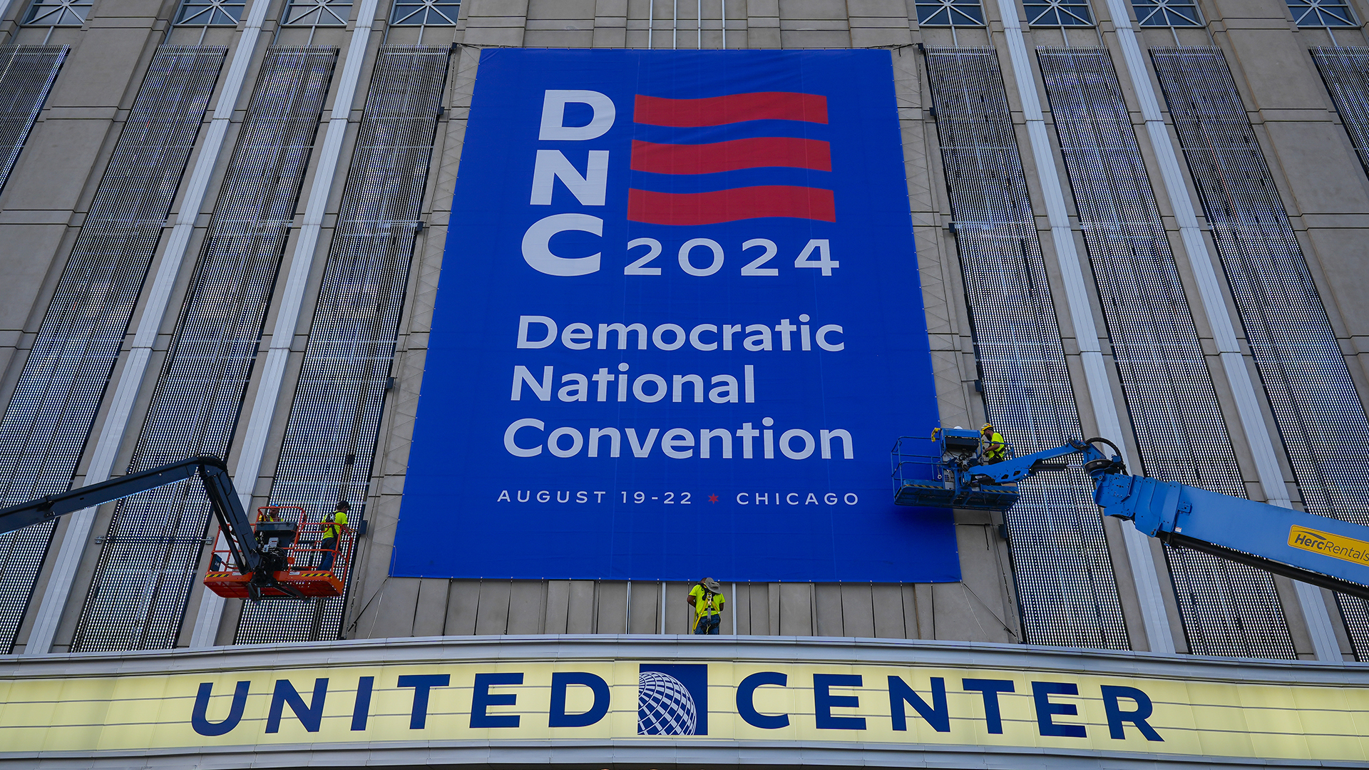 Signage is hung on the exterior of the United Center in preparation for next week's Democratic National Convention in Chicago on Wednesday, Aug. 14, 2024.