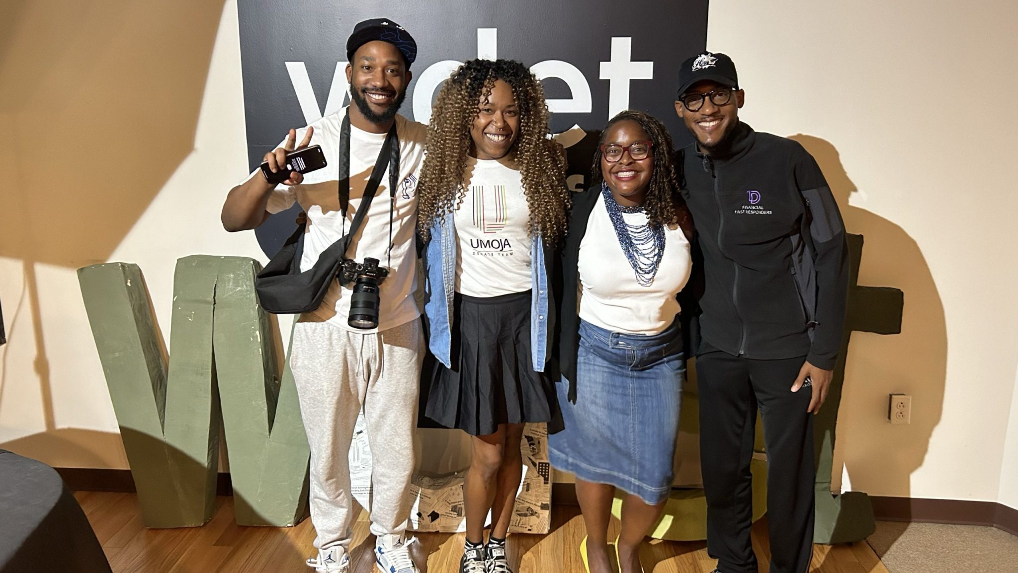 Detroit photographer Elonte Davis (from left), "The Metro" host Tia Graham, Design Core Detroit Co-executive Director Kiana Wenzell, and "The Metro" guest -co-host Orlando Bailey pose for a photo at WDET Studios.