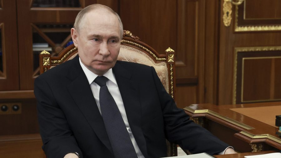 Russian President Vladimir Putin listens to the head of the Republic of Mordovia Artem Zdunov during their meeting at the Kremlin in Moscow, Russia, Thursday, Aug. 1, 2024.