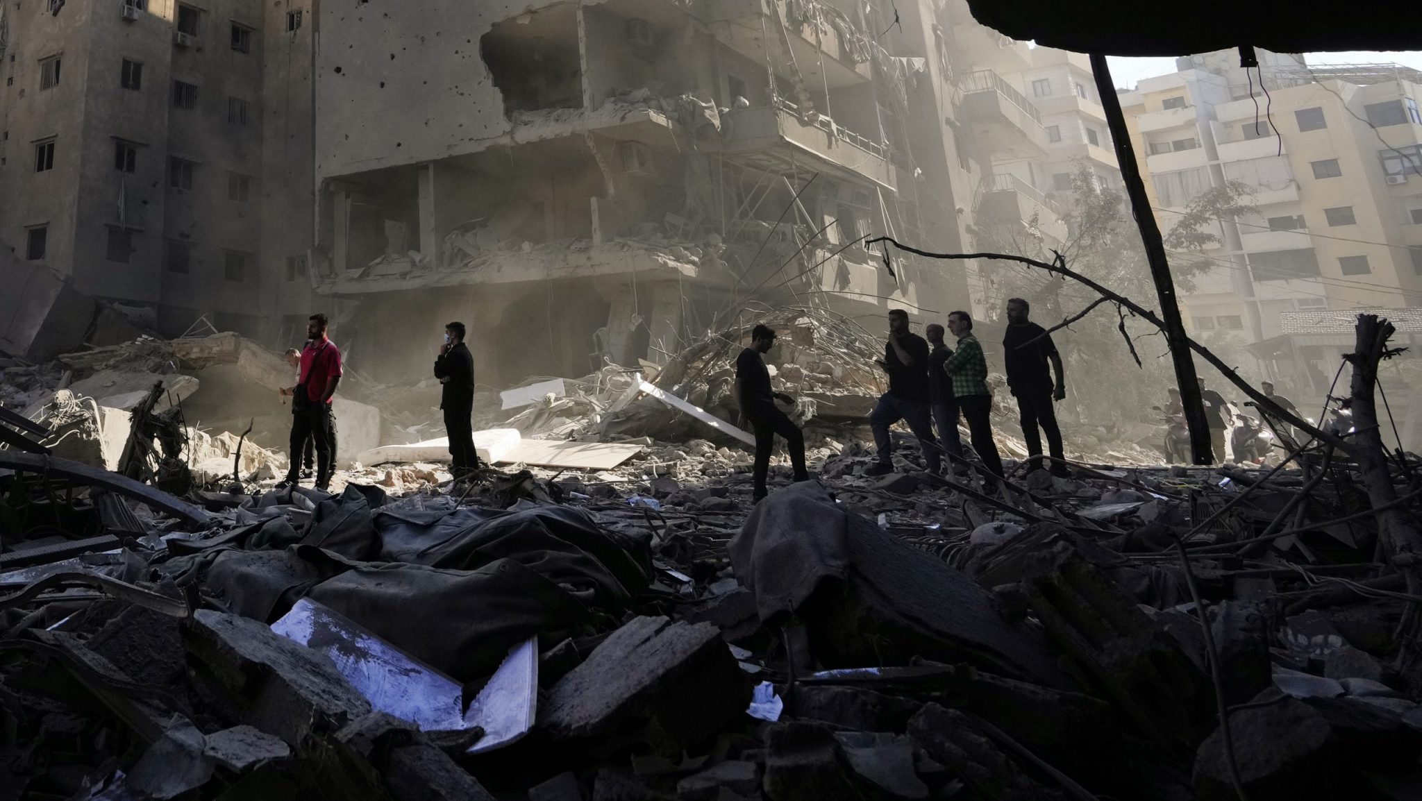 People check the site of the assassination of Hezbollah leader Hassan Nasrallah in Beirut's southern suburbs, Sunday, Sept. 29, 2024.