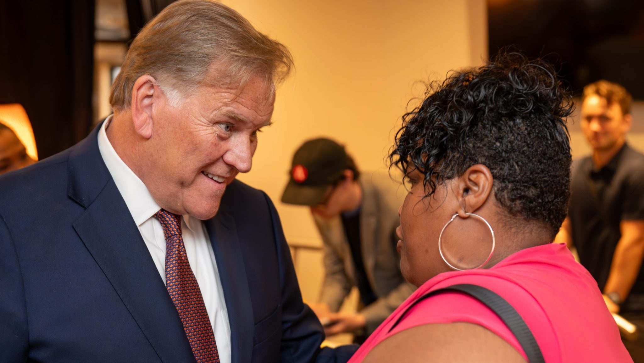 Michigan U.S. Senate candidate Mike Rogers talks with a potential voter at a roundtable for conservative Black clergy in Detroit on Thursday, Sept. 26, 2024.