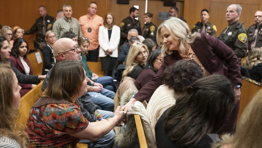 FILE - Oakland County Prosecutor Karen McDonald, right, shakes hands with Oxford High School victim parents after Jennifer Crumbley was found guilty on four counts of involuntary manslaughter in the Oakland County courtroom, Feb. 6, 2024 in Pontiac.