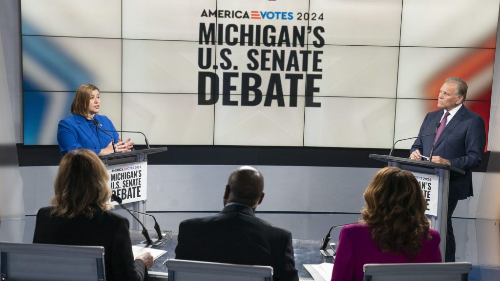 U.S. Rep. Elissa Slotkin (D-Holly), the Democratic candidate for the open Michigan U.S. Senate seat, left, and former U.S. Rep. Mike Rogers, the Republican candidate vying for the seat, debate the issues Monday, Oct. 14, 2024, with moderators Alicia Smith, Chuck Stokes and Carolyn Clifford of WXYZ-TV in Southfield.