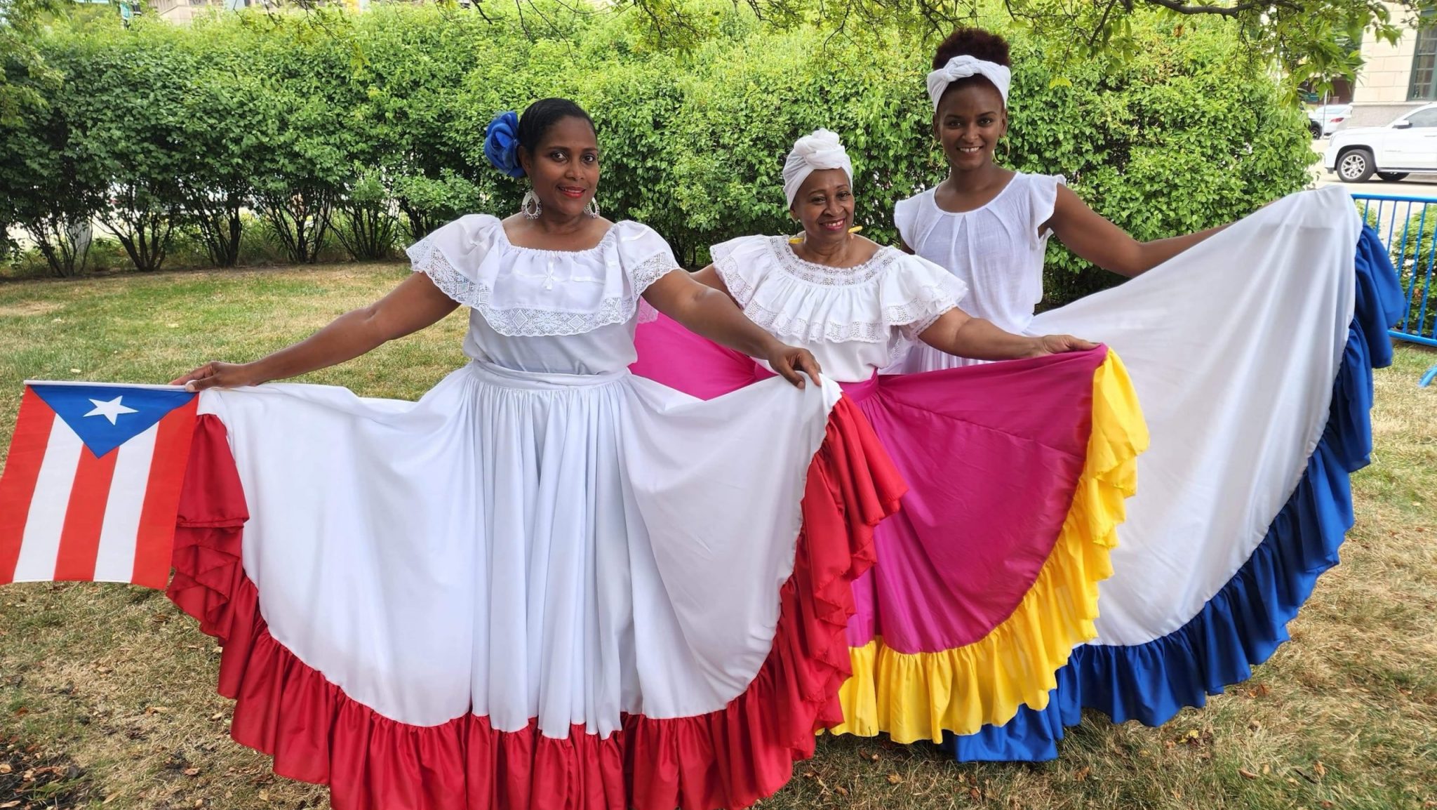 Dancers Angela Lugo (from left), Sheila Royster and Celia Benvenutti performed with Ozzie Rivera and Rican Struction at the 2024 Concert of Colors.