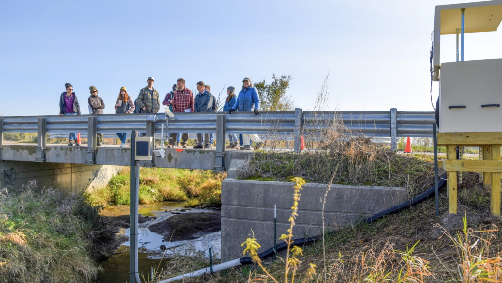 Researchers, policy-makers, and government officials gather to get a briefing on a stream monitoring system in southwest Washtenaw County. The on-site, real time data collection system is one of many in the Michigan watersheds flowing into Lake Erie.