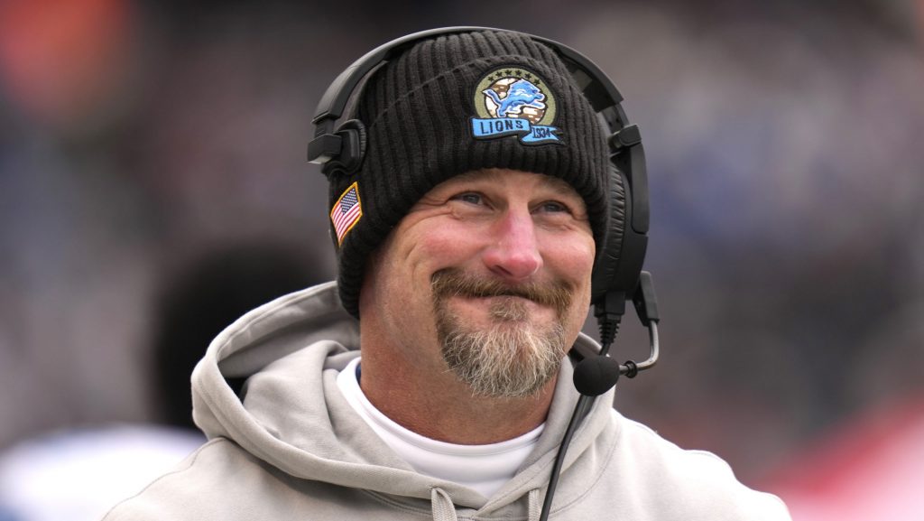 Detroit Lions head coach Dan Campbell smiles along the sidelines during the first half of an NFL football game against the Chicago Bears on Sunday, Dec. 22, 2024, in Chicago.
