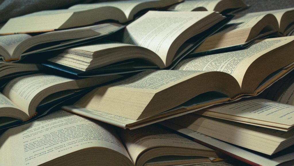 a pile of open books