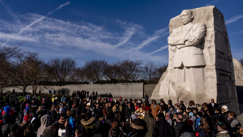 FILE - People attend a wreath-laying ceremony at the Martin Luther King Jr. Memorial marking MLK Day in Washington, Jan. 16, 2023.