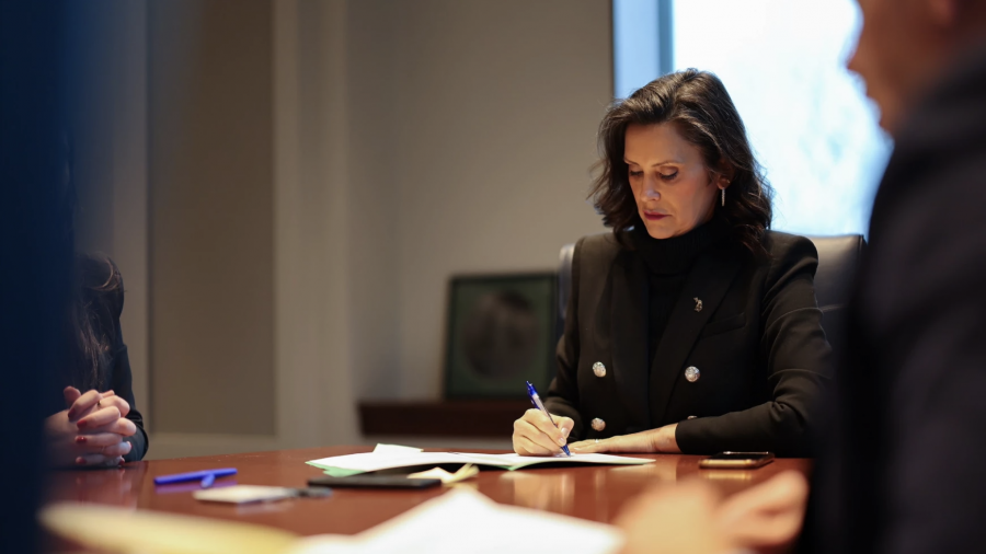 File - Gov. Gretchen Whitmer signs bills into law in Lansing on December 17, 2024.