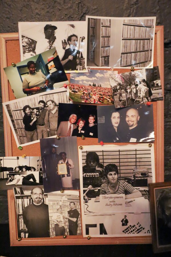 A bulletin board shows an assortment of photos of past and current WDET staff.