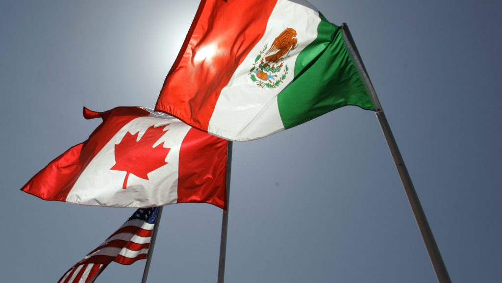 The American, Canadian and Mexican flag fly side by side.