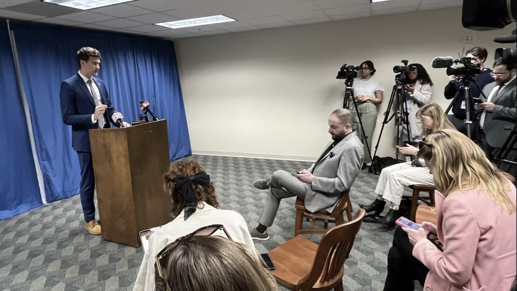 Michigan Sen. Jeremy Moss (D-Southfield) takes a front row seat as Rep. Josh Schriver (R-Oxford) calls for the U.S. Supreme Court to reverse its marriage equality decision.