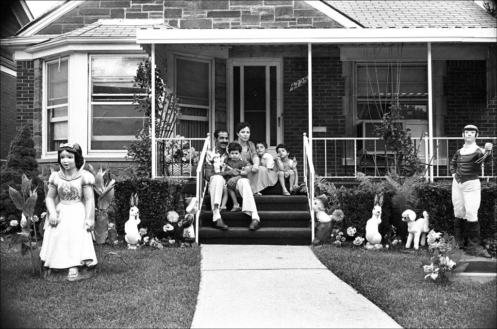 A family in Dearborn's Southend on their front porch. This photograph is featured in "Seeing the Southend" at the Arab American National Museum.