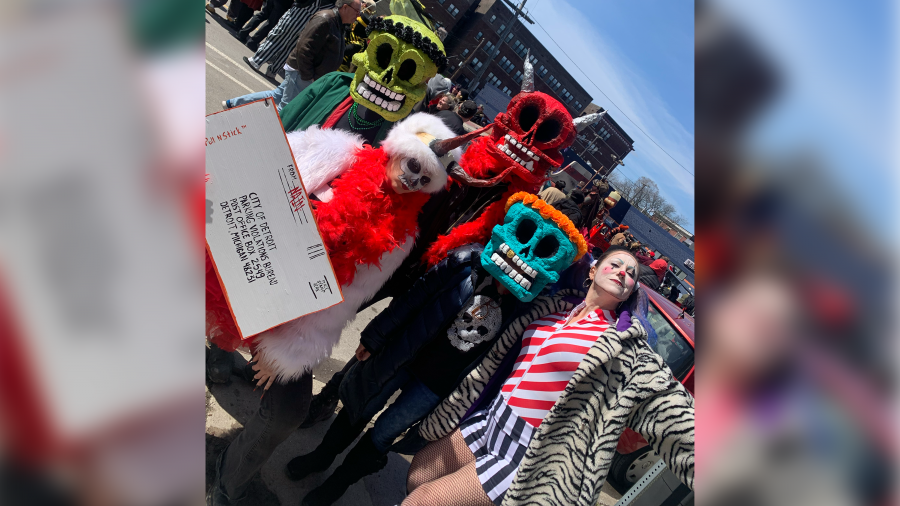 Revelers gather for the 2024 Marche du Nain Rouge in Detroit's Cass Corridor.